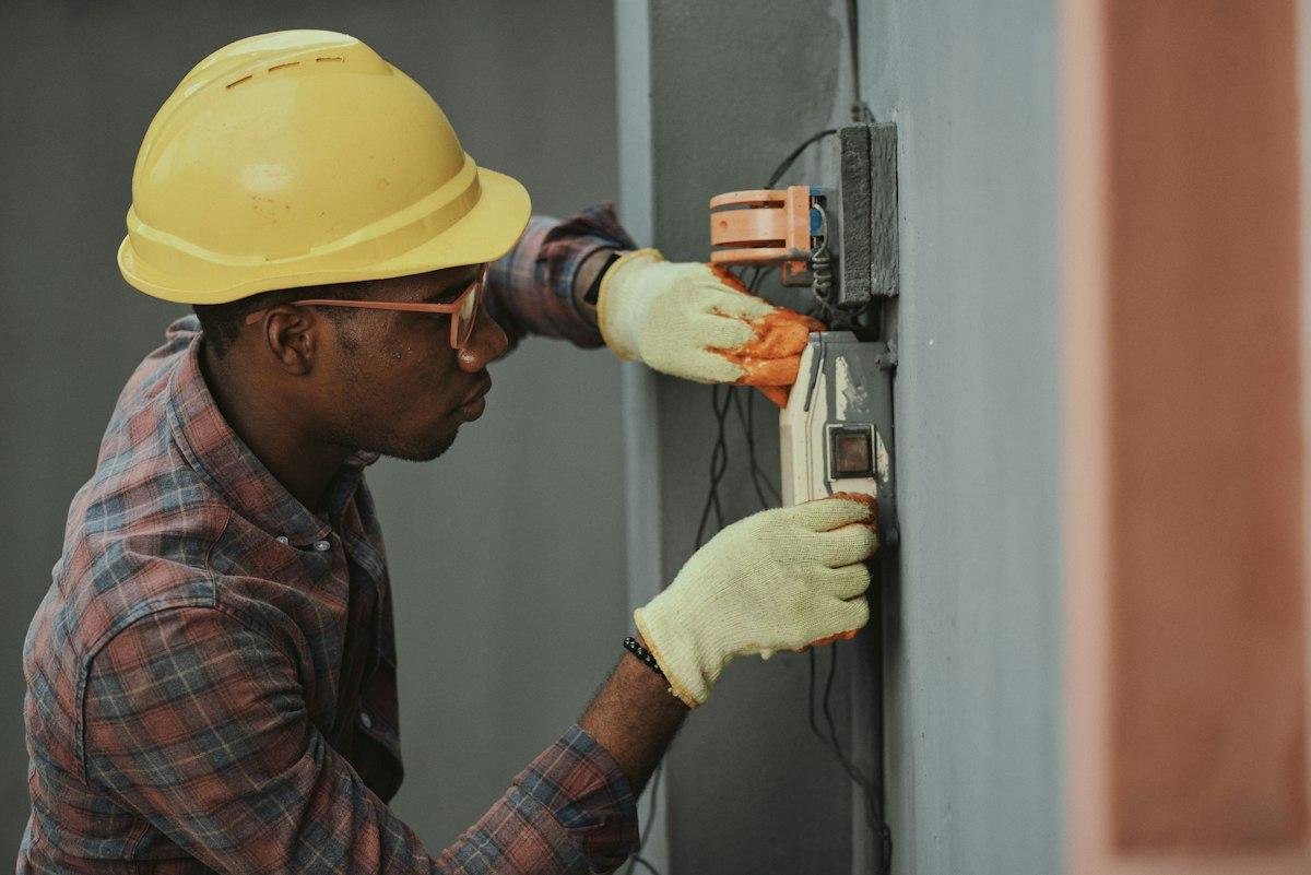 Technician repairing electrical inverter system